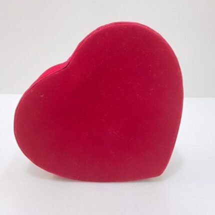 Velvet heart-shaped gift box on white surface, ideal for premium corporate gifting presentations.
