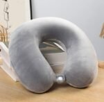 Grey Plain Micro Neck Pillow on table—ideal premium corporate gift for travel comfort.