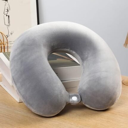 Grey Plain Micro Neck Pillow on table—ideal premium corporate gift for travel comfort.
