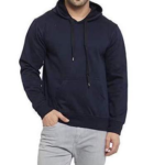 Man models corporate gift: dark blue pullover hoodie with front pocket, light gray pants, white background.