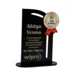 Corporate gift: Black wooden trophy with gold-red "20 Years of Service" badge, honoring Aditya Verma at Wipro.