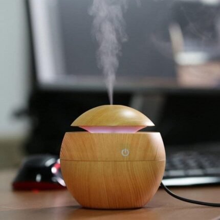 Wooden Cool Mist Diffuser on office desk; ideal for corporate gifting and creating a calming workspace.