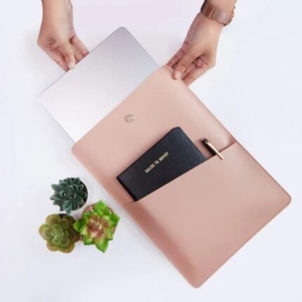 Snug Shield Laptop Sleeve in pink with notebook, pen, and laptop—ideal premium corporate gift.